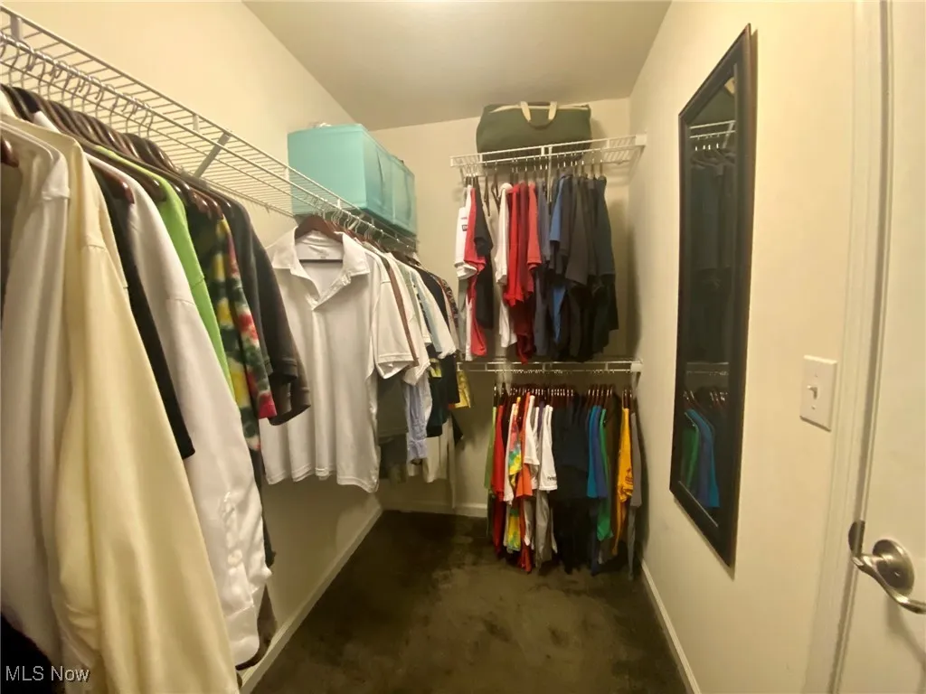 The second walk-in closet in the primary bedroom offers additional space and organization, ensuring ample room for your entire wardrobe. With built-in shelving and hanging space, it provides both convenience and luxury, enhancing the functionality of this already spacious retreat.