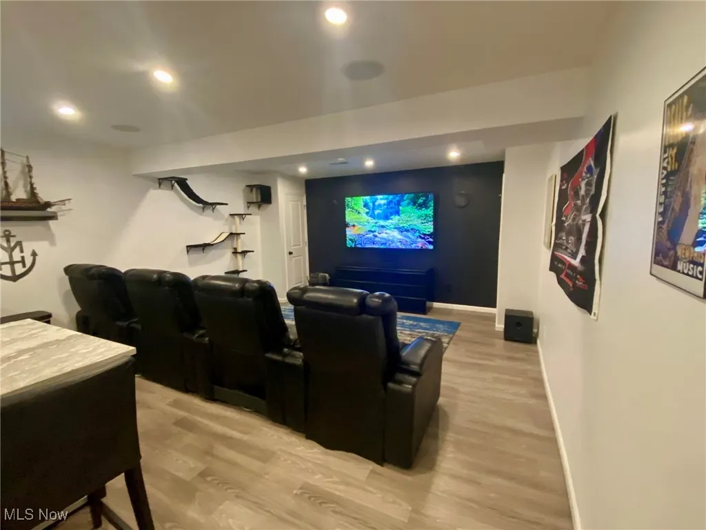 The media room is designed for the ultimate entertainment experience, featuring built-in multi-color lights, a large TV, and an immersive sound system. Whether you're watching the big game or enjoying a movie night, this space offers the perfect setting for both relaxation and excitement.