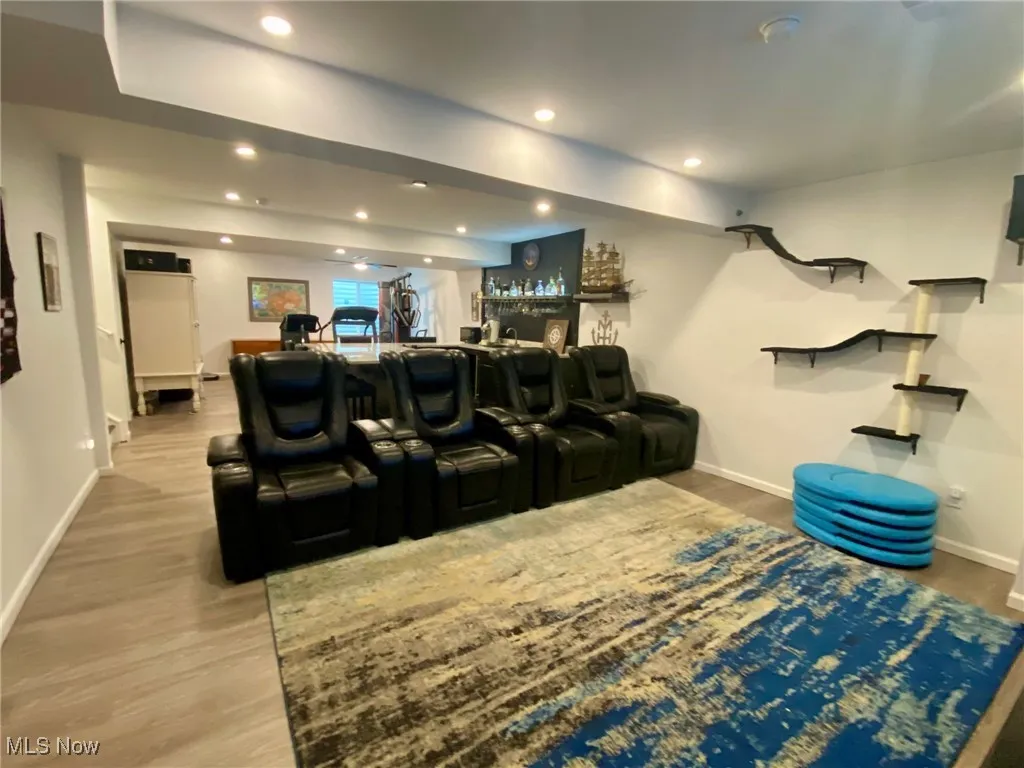 The media room is designed for the ultimate entertainment experience, featuring built-in multi-color lights, a large TV, and an immersive sound system. Whether you're watching the big game or enjoying a movie night, this space offers the perfect setting for both relaxation and excitement.