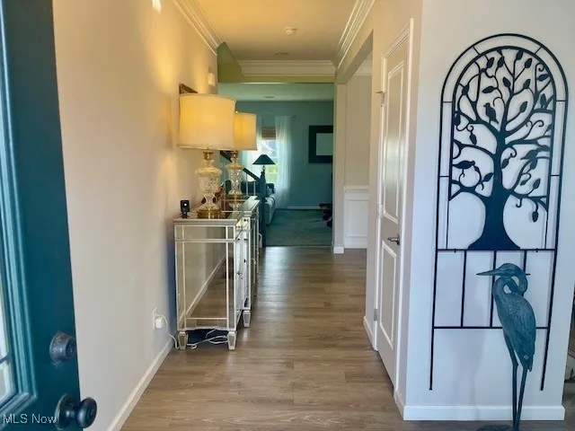 As you enter, you'll be greeted by a spacious foyer with a convenient coat closet, offering the perfect place to store jackets and accessories as you step inside.