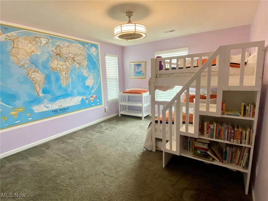 This delightful children’s bedroom perfectly balances practicality and imagination. Equipped with a safe ceiling fan to keep things comfortable, it’s the perfect haven for little explorers. The inspiring world map mural sparks curiosity and dreams of adventure, making this room a wonderful blend of fun and functionality.