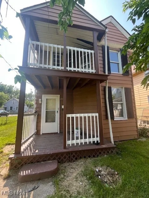 front view of property featuring a balcony