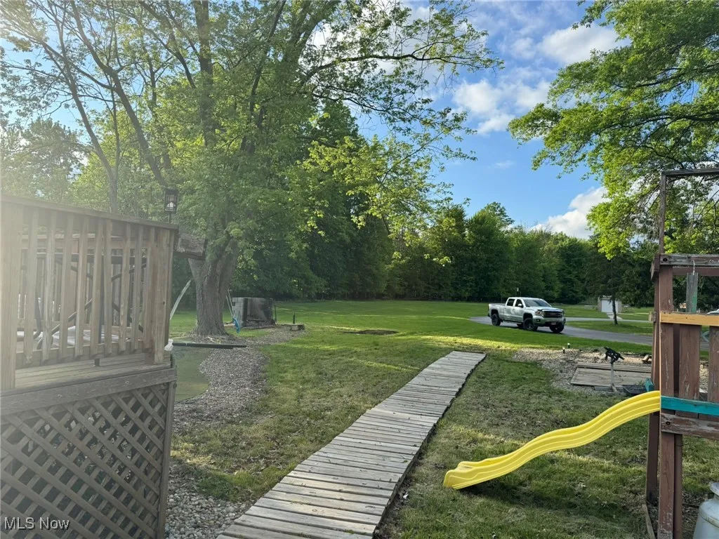 View of green lawn with a playground