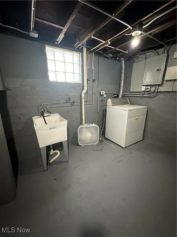 Basement with washer / clothes dryer and electric panel