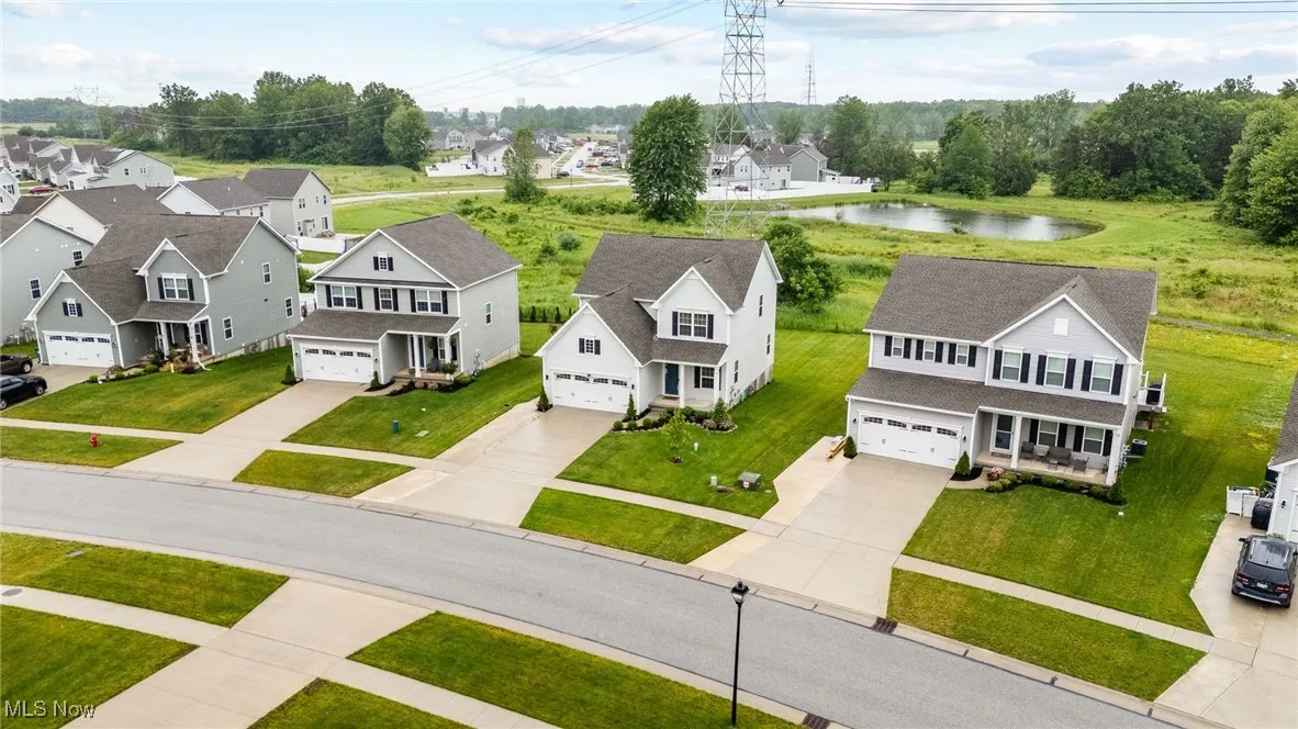 Aerial view of residential area featuring a large body of water