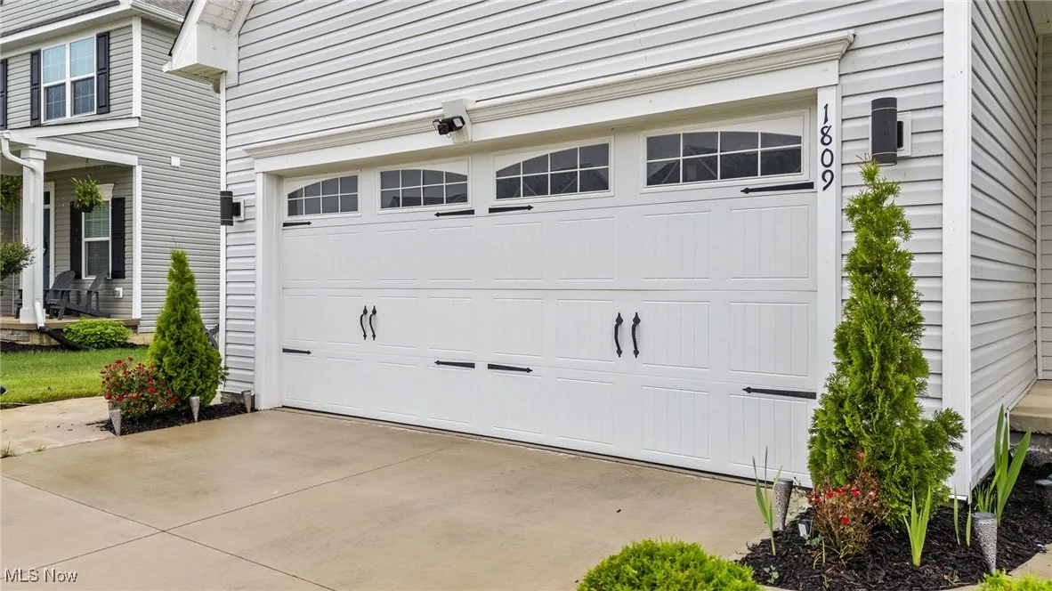 Garage featuring driveway