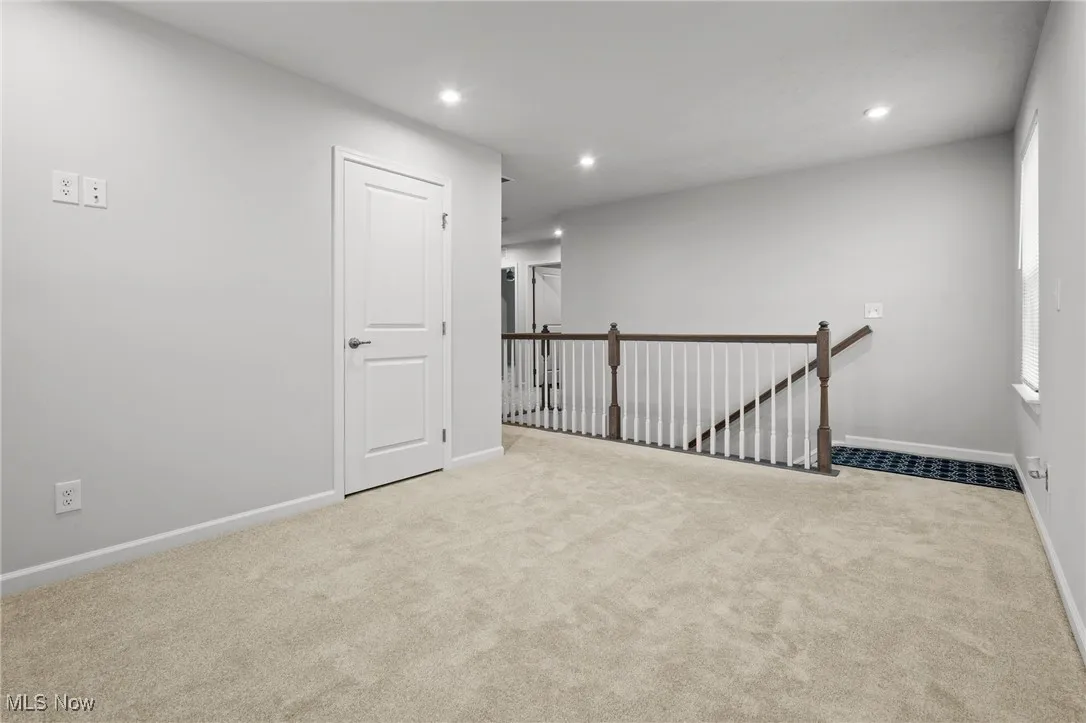 Unfurnished room featuring carpet and recessed lighting