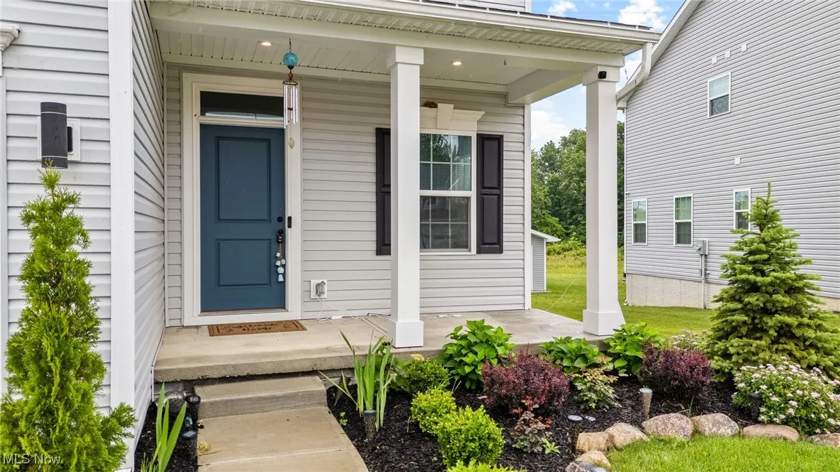 Property entrance featuring covered porch