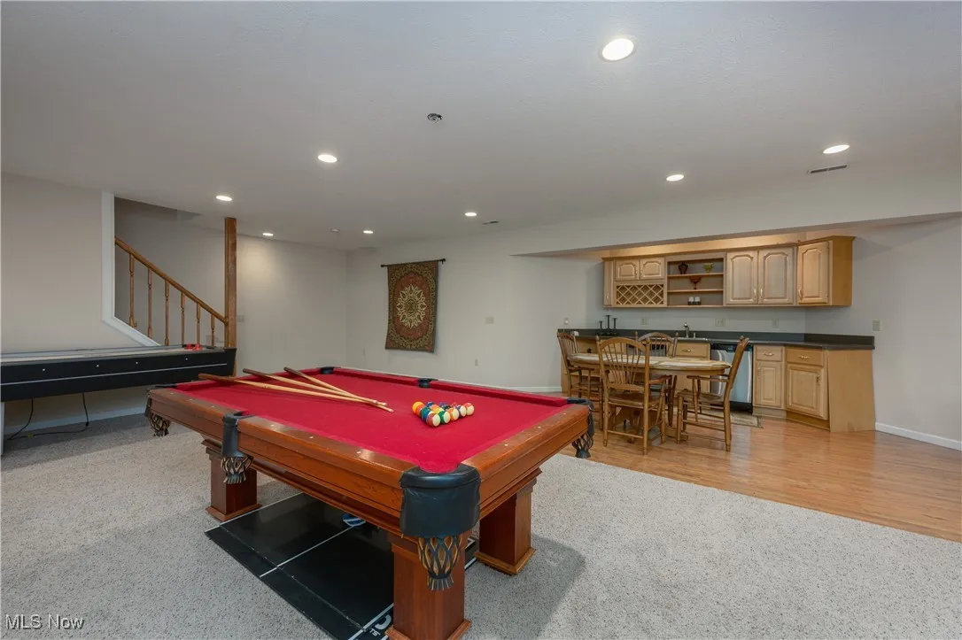 Rec room with wet bar, light carpet, recessed lighting, and billiards