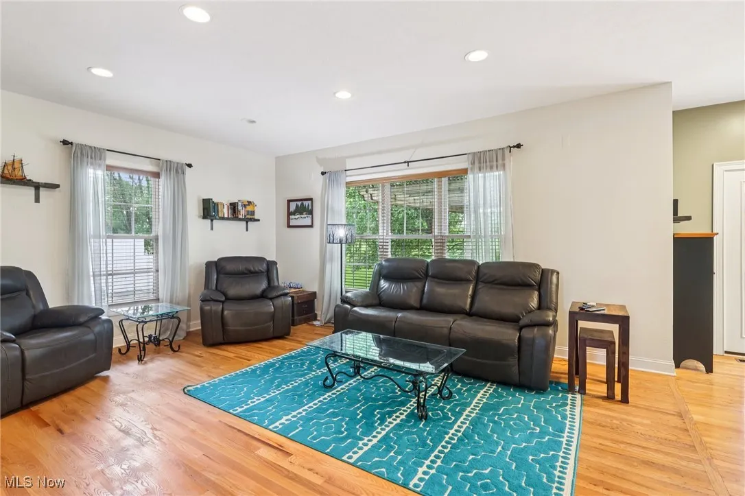 The family room is brightened by large windows, and doors to the back deck.