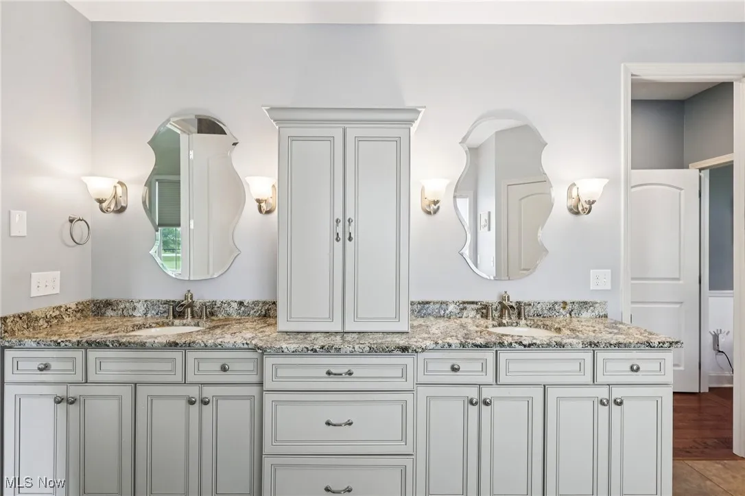 The primary bathroom includes a separate commode room.