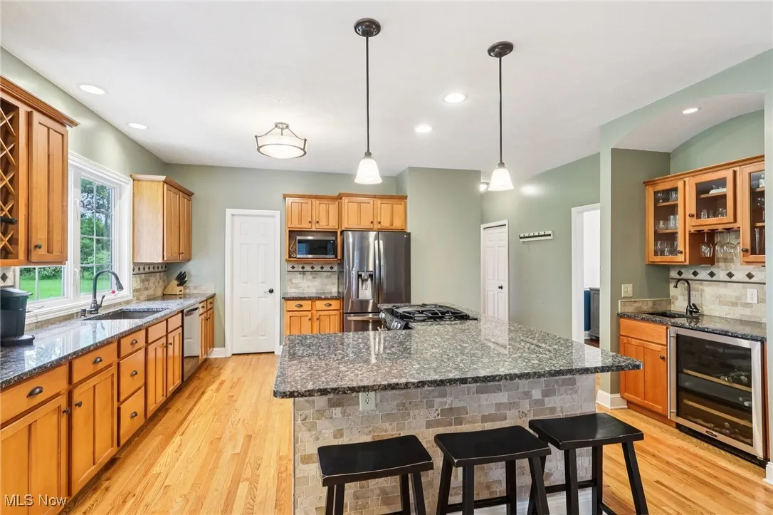 Updated kitchen with center island and breakfast bar.