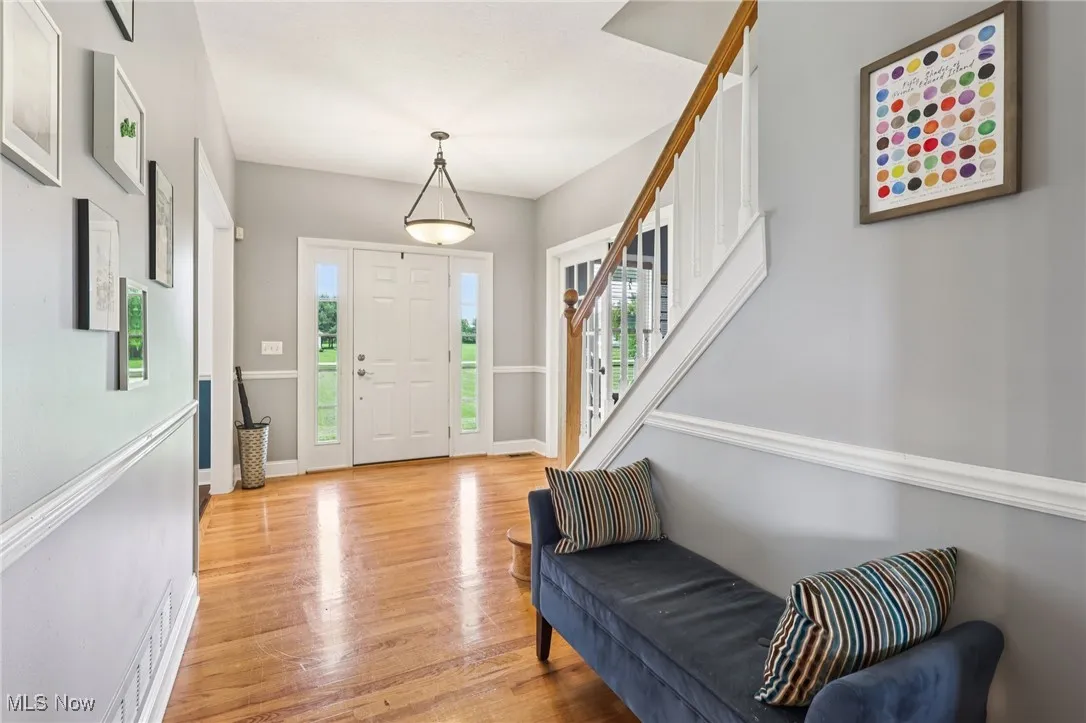 The large foyer allows for comfortable greeting of guests, and leads to the dining room (right), office (left) and kitchen (straight ahead).