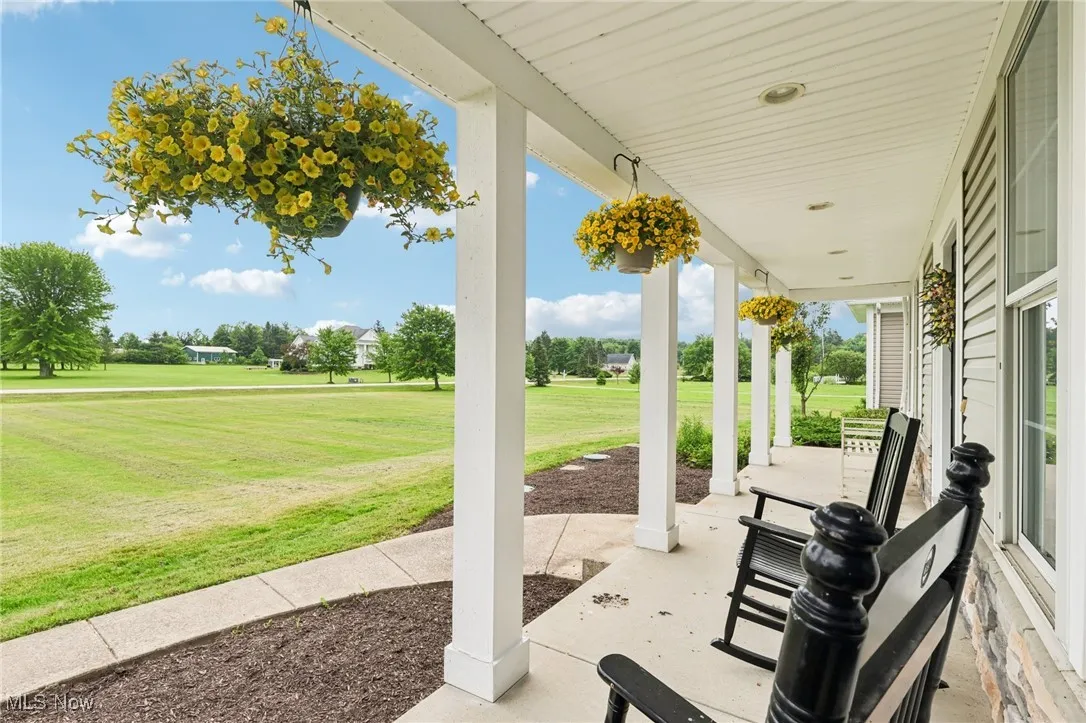 Your home welcomes neighbors and guests with a large front porch.