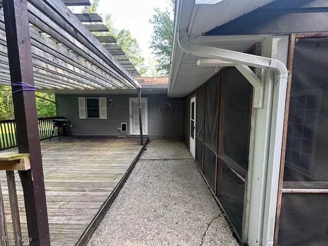 Deck featuring a pergola