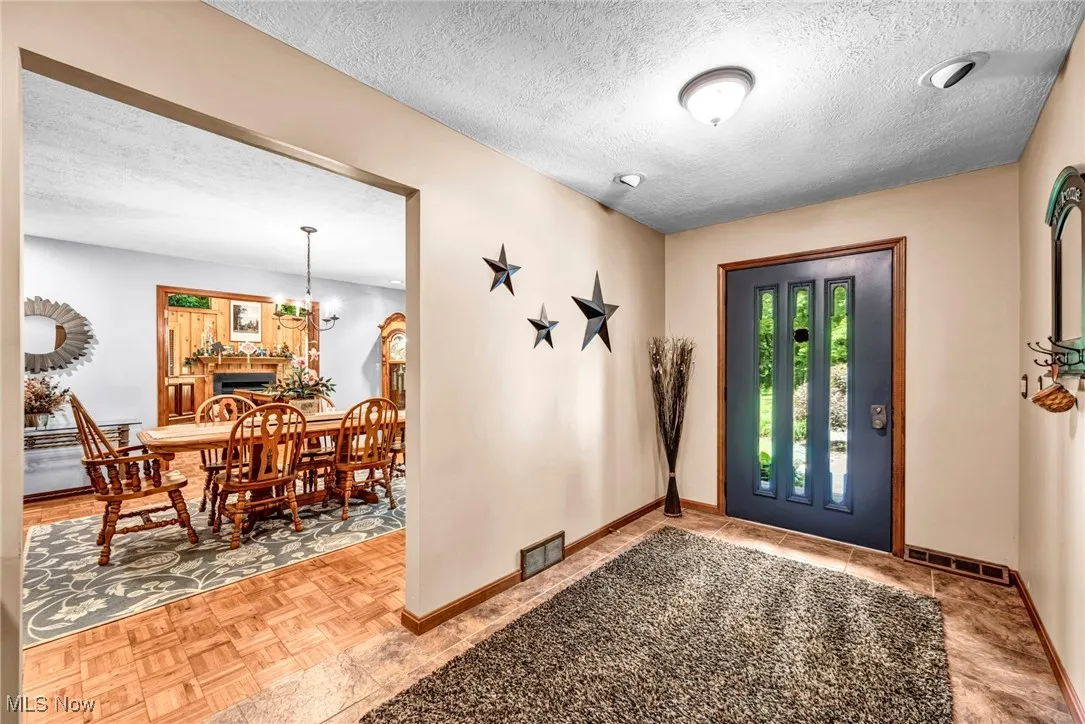 Entrance foyer with a textured ceiling