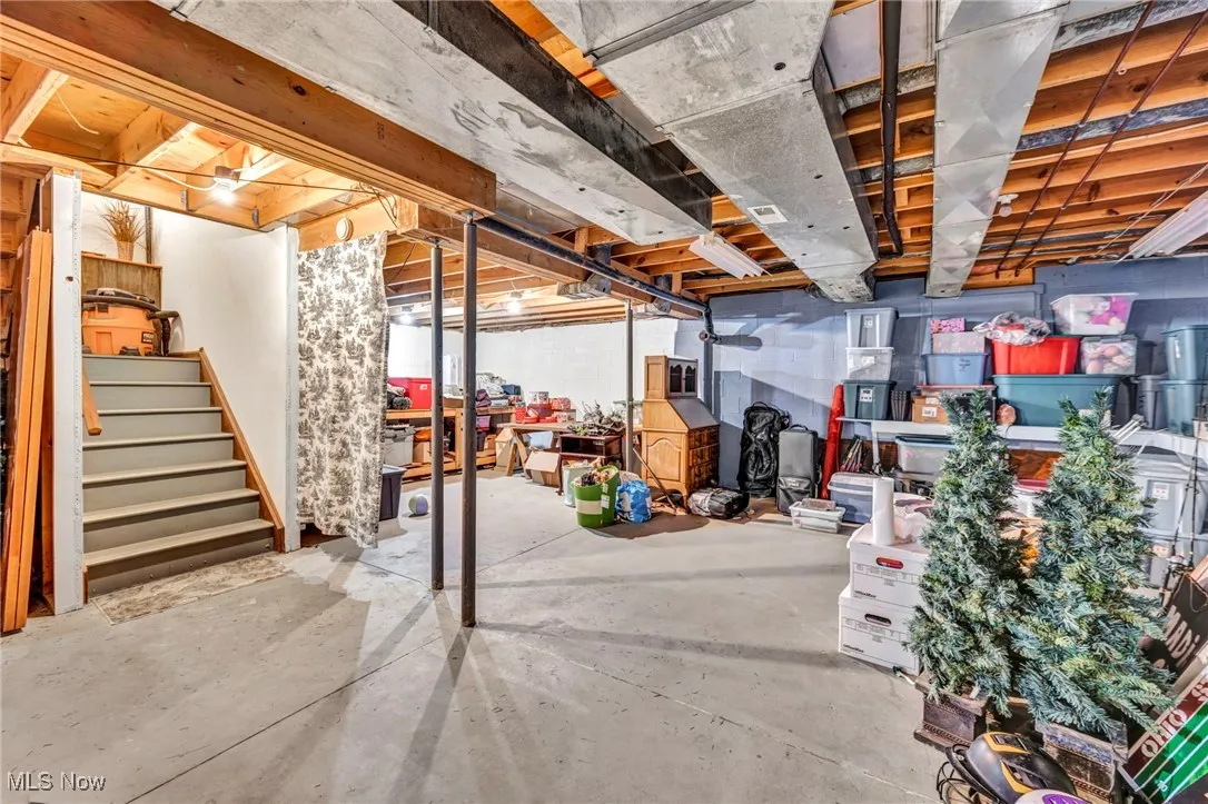 Unfinished basement with stairs