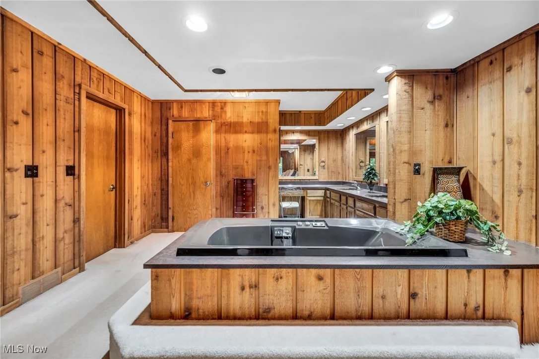 Master bedroom featuring a jacuzzi tub.