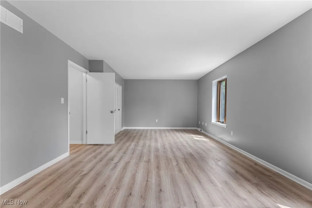 Empty room featuring light wood-style floors and baseboards
