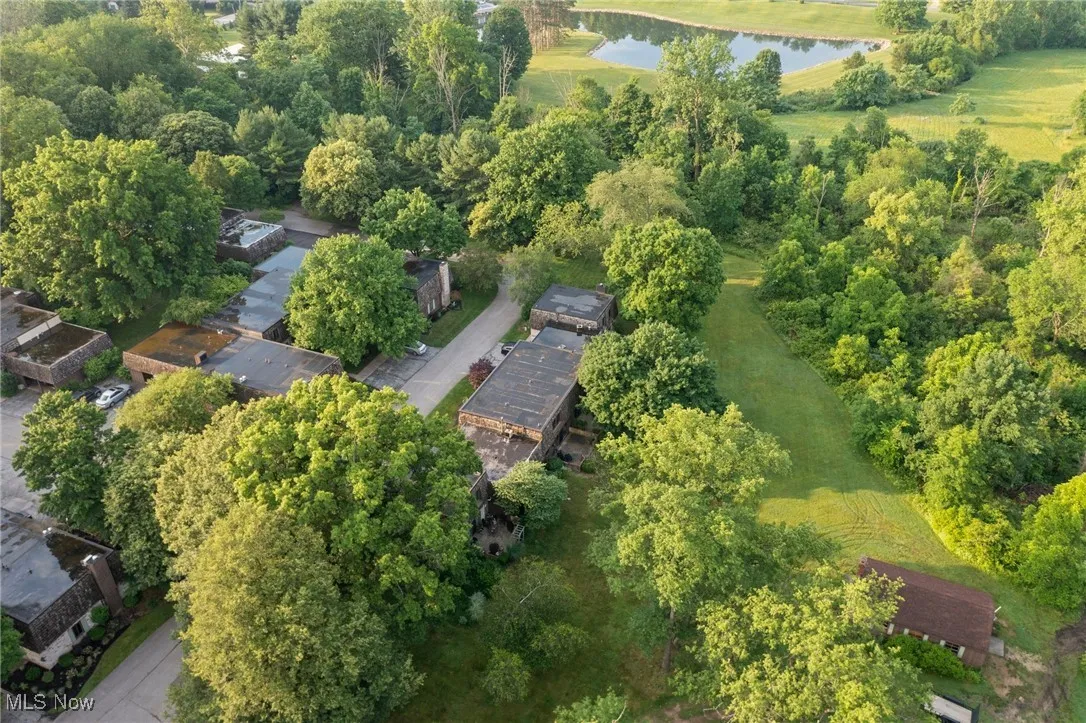 Aerial view of property and surrounding area featuring a large body of water