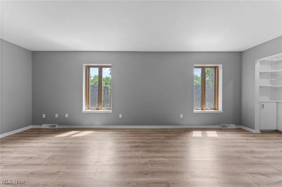 Unfurnished room with wood finished floors