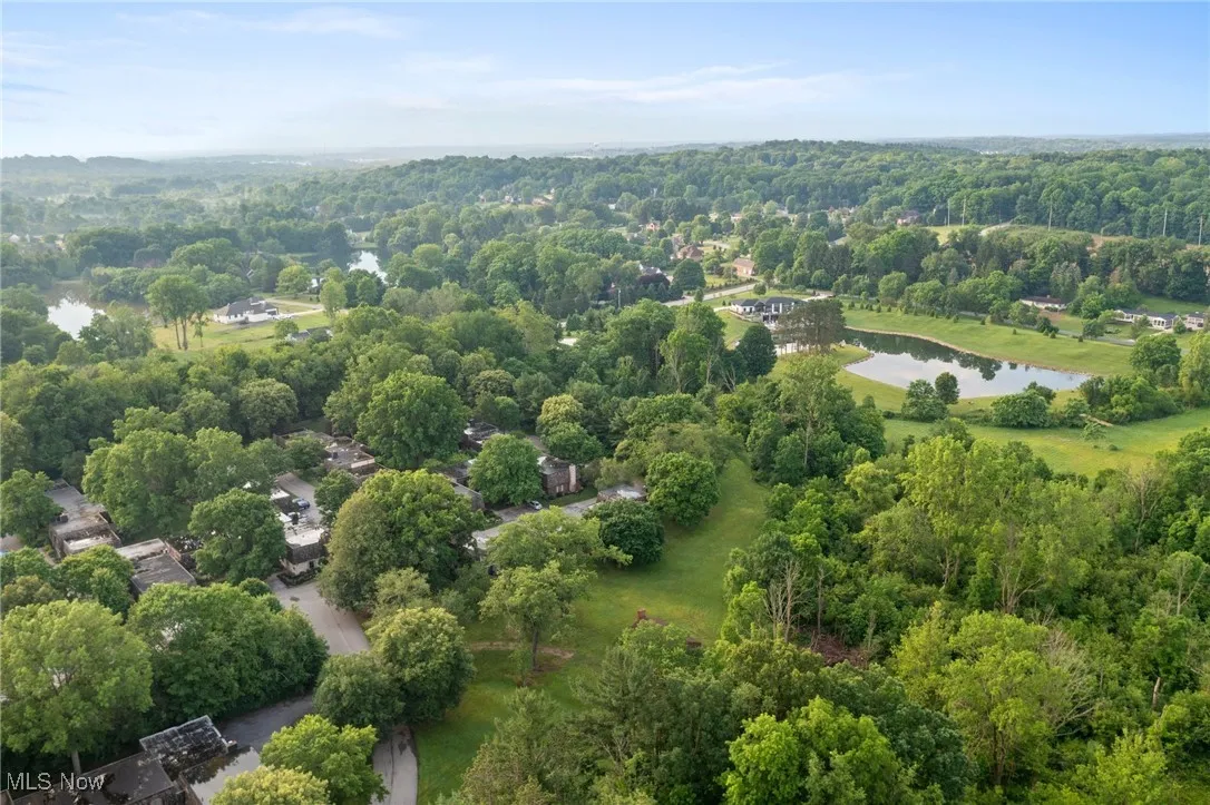 Aerial view of a large body of water and a heavily wooded area
