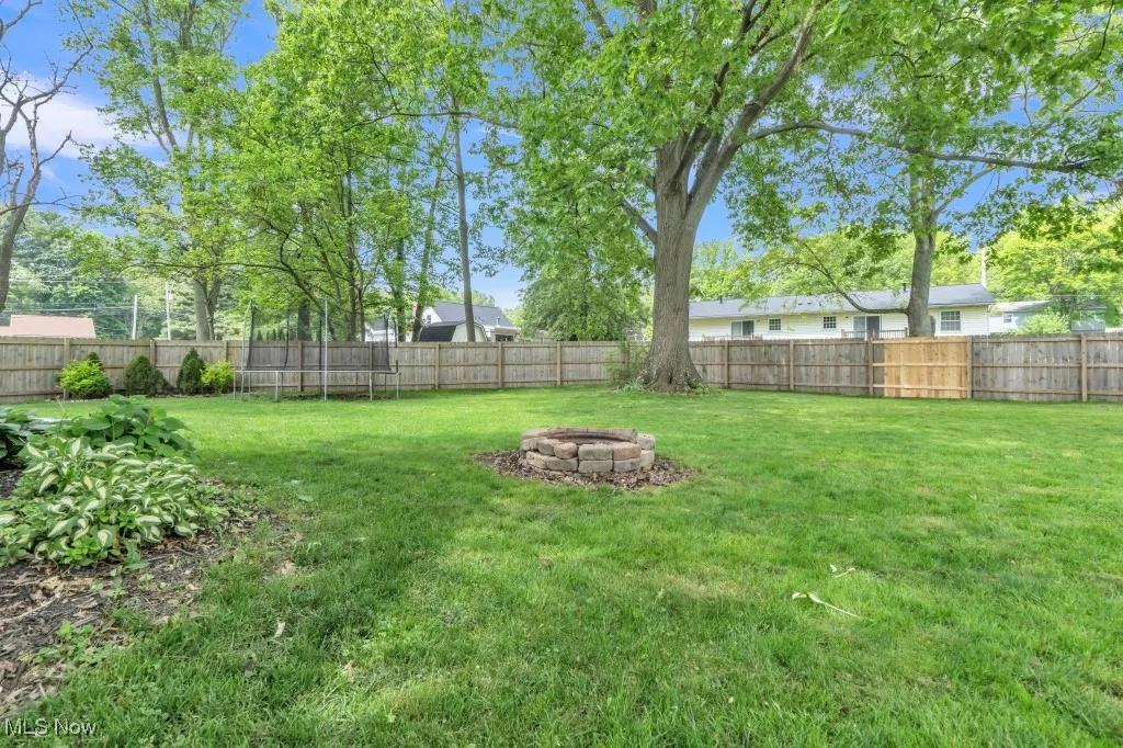 View of yard with a fire pit