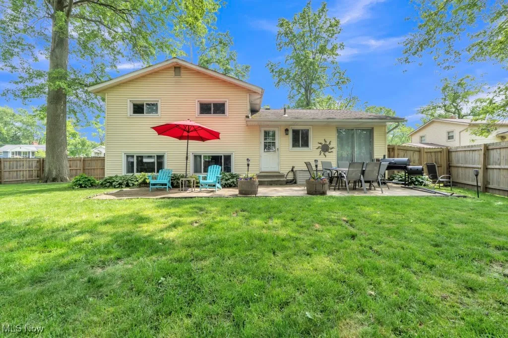 Back of property with a patio and entry steps