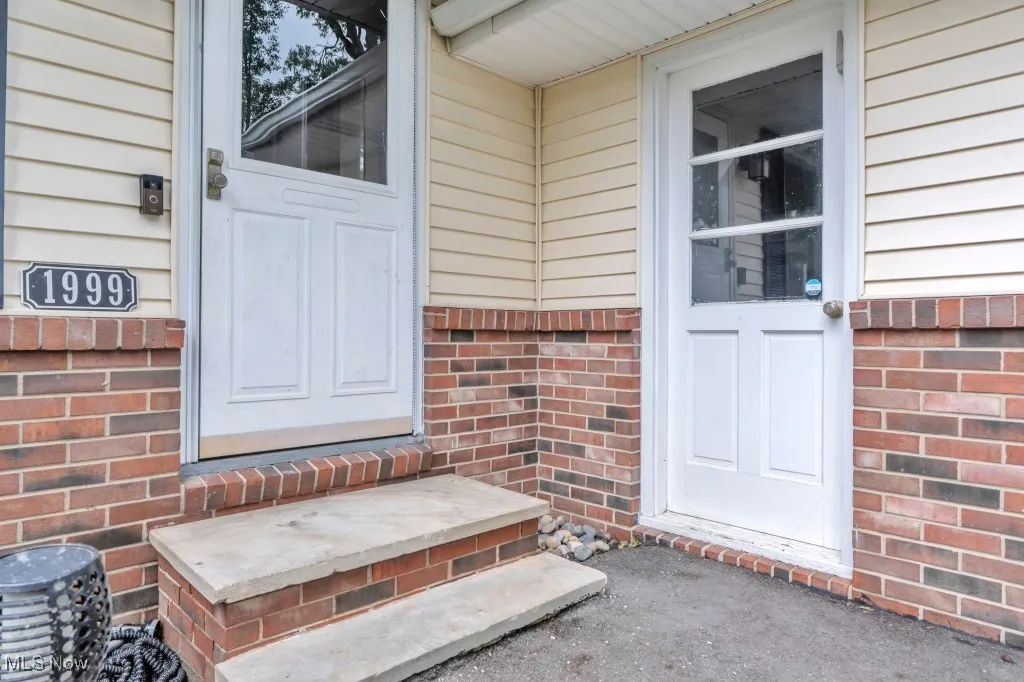 Property entrance with brick siding