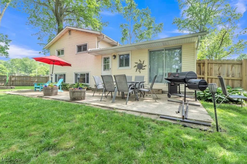 Rear view of house featuring a patio area