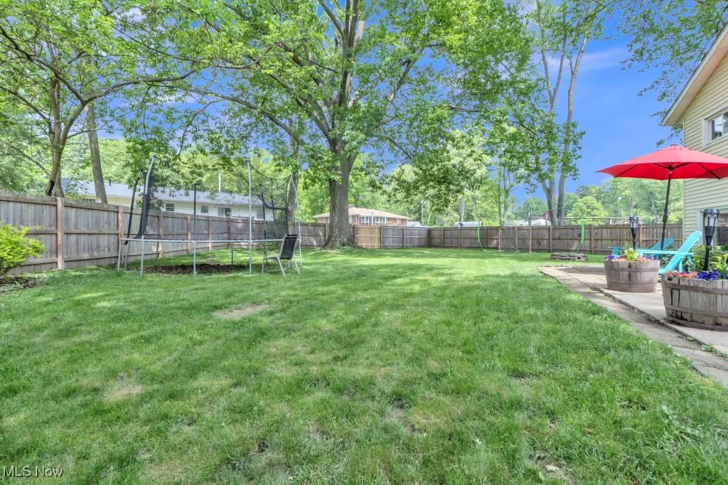 View of yard featuring a trampoline