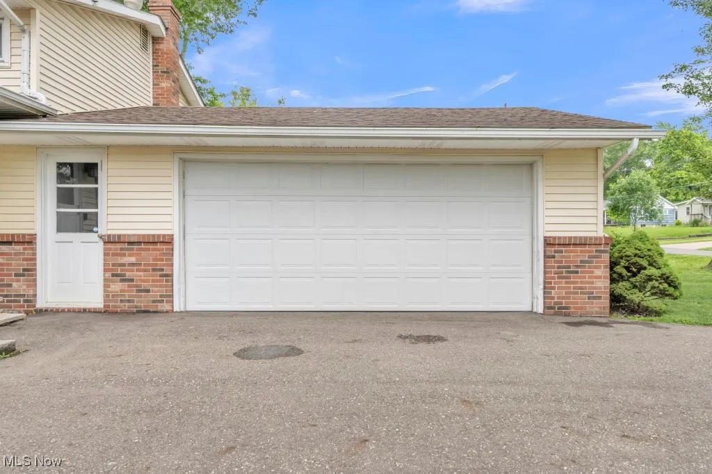 Garage with asphalt driveway
