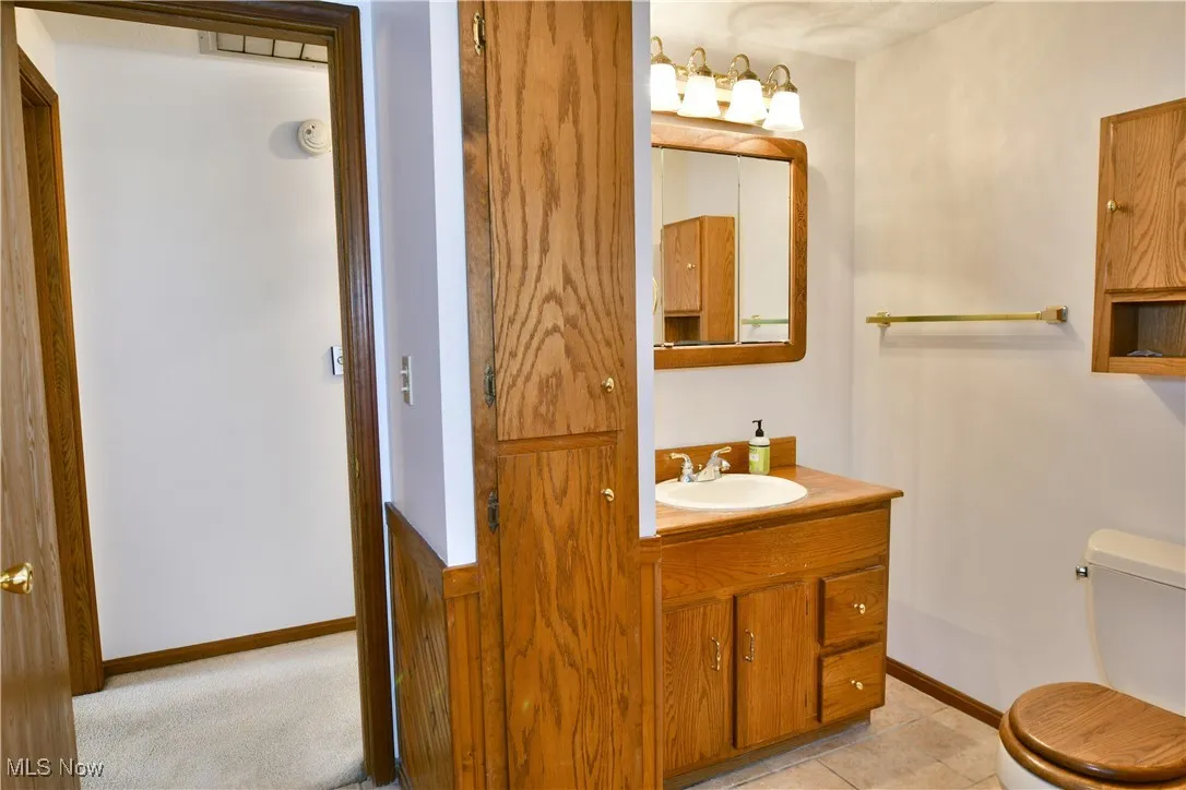 Bathroom featuring toilet and vanity