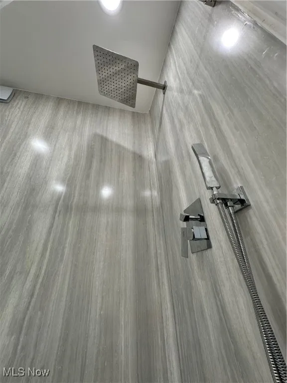 Bathroom view of marble like walled shower!