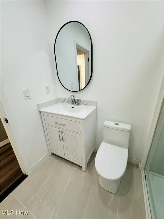 Bathroom with vanity and tile patterned floors