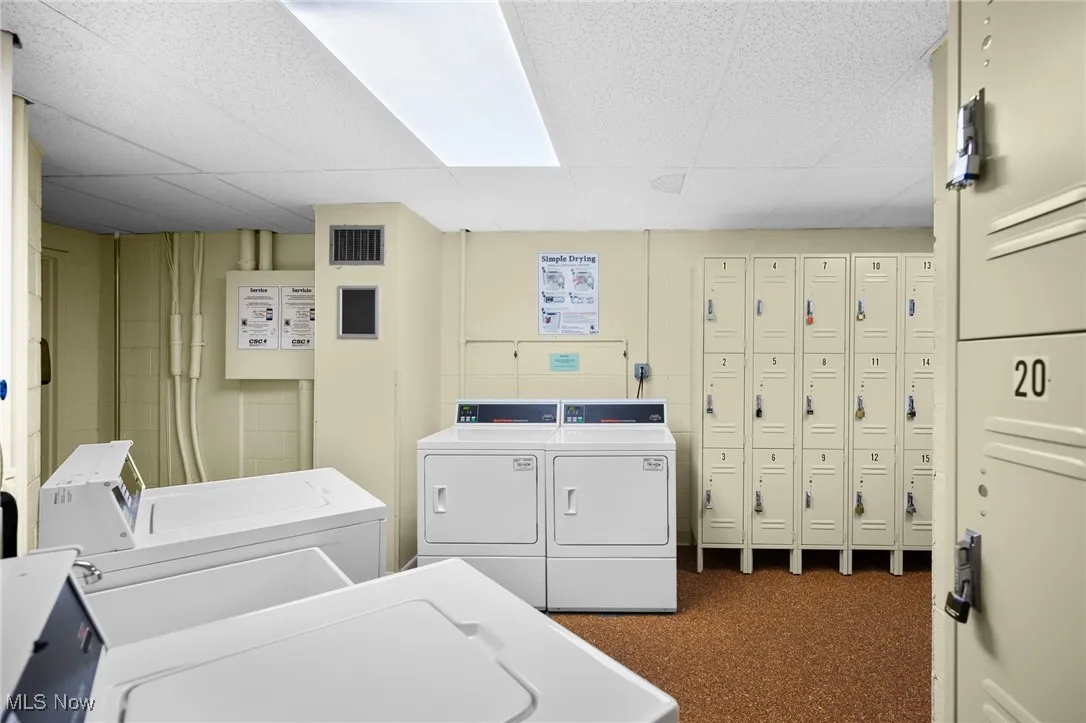 Shared laundry featuring washing machine and clothes dryer