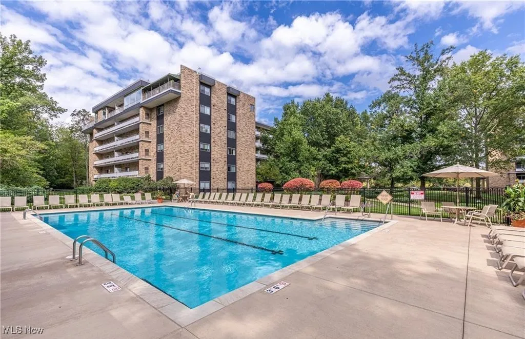 Community pool with a patio area