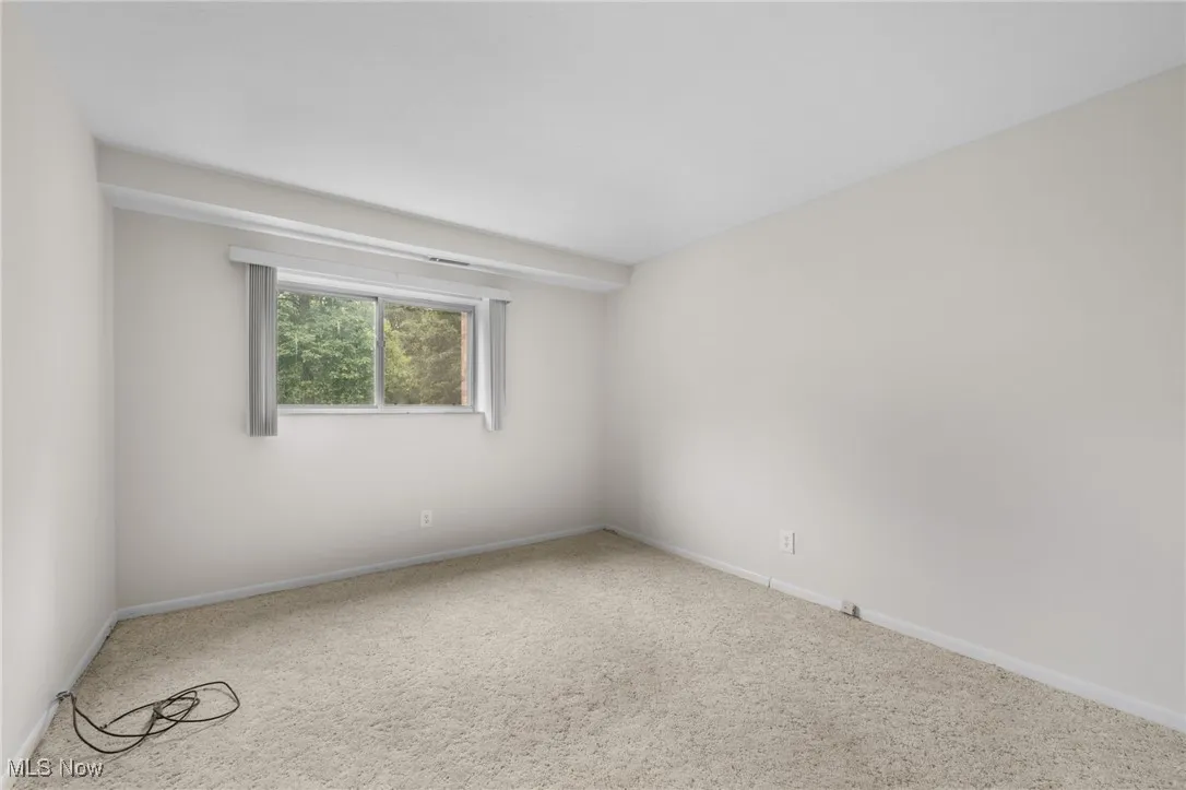 Bedroom with carpet and baseboards