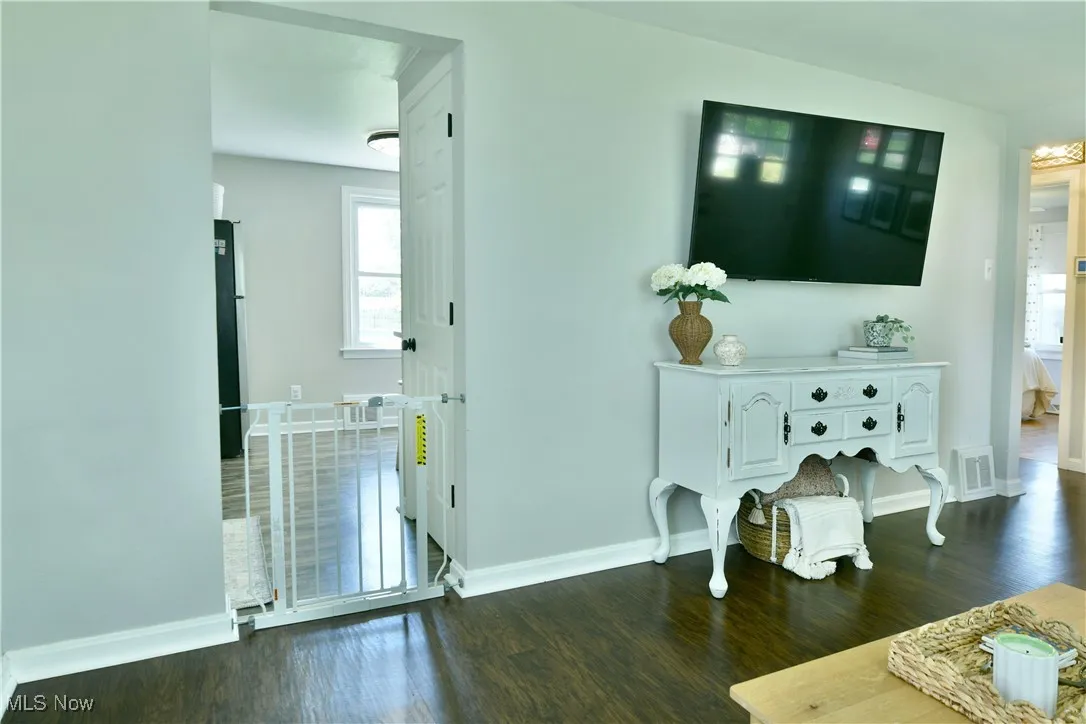 Living area with dark wood-style floors