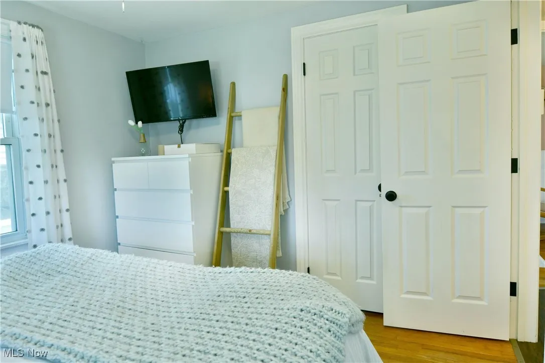 Bedroom with wood finished floors