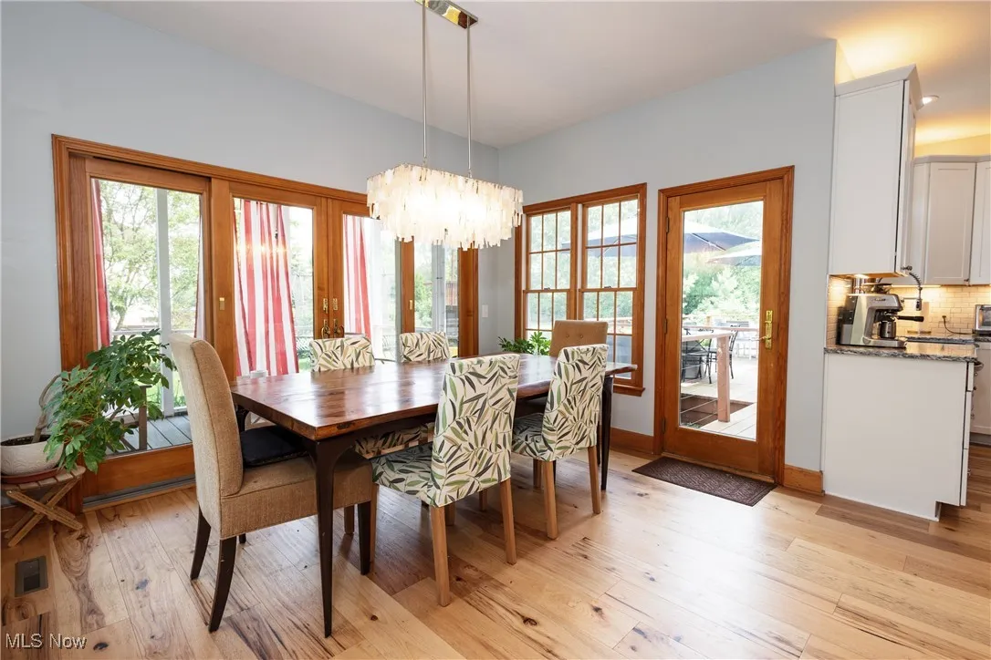 Dining room featuring a chandelier and hardwood floors