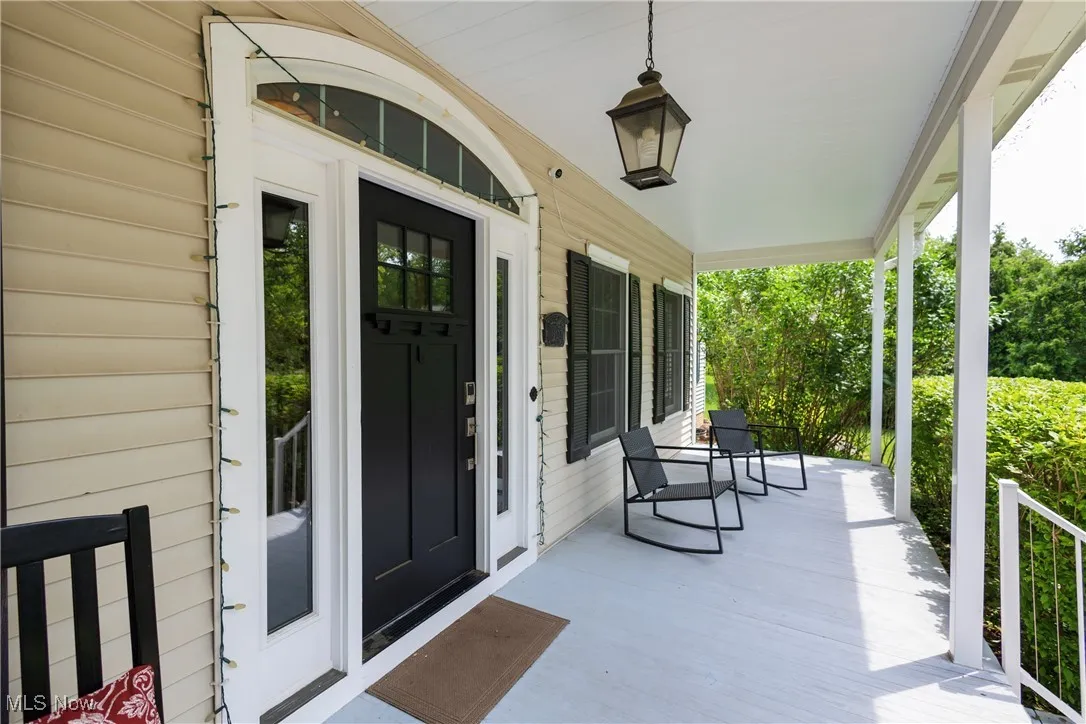 Property entrance with covered porch