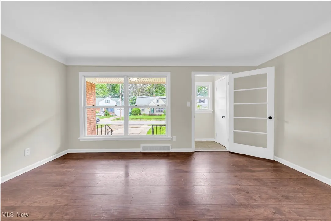 Spare room featuring hardwood / wood-style floors and french doors