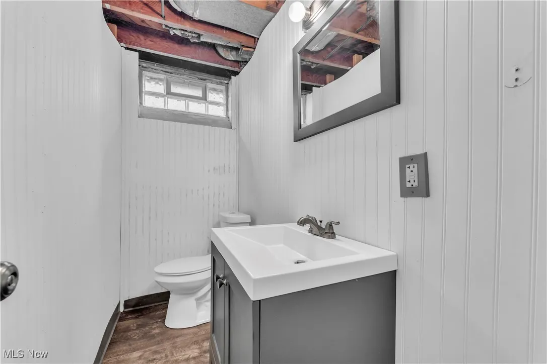 Bathroom featuring vanity and wood finished floors