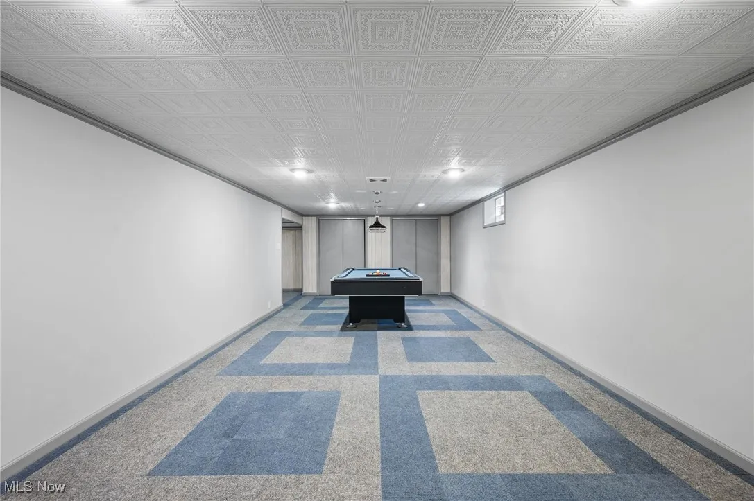 Hall featuring carpet flooring