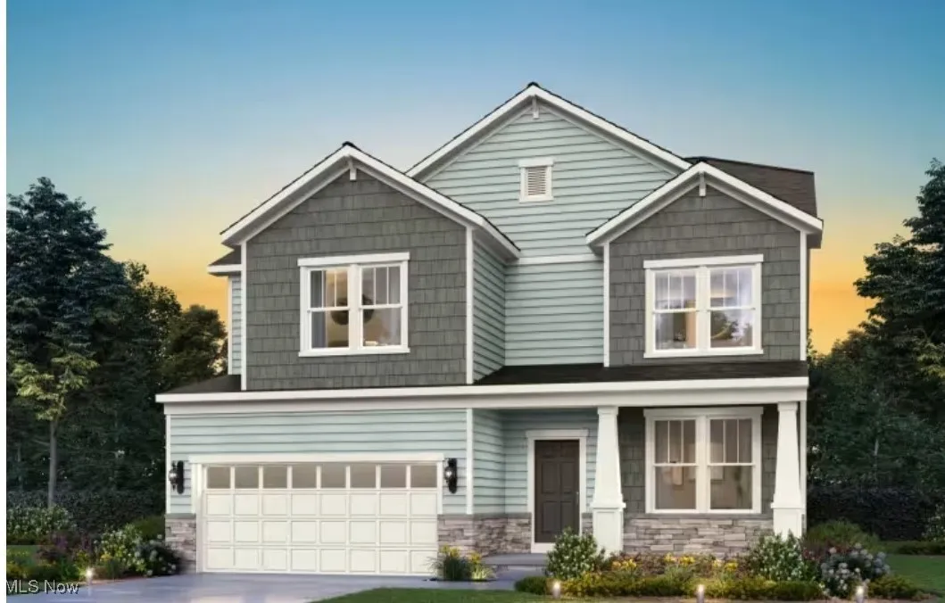 Craftsman styled exterior with stone wainscotting.