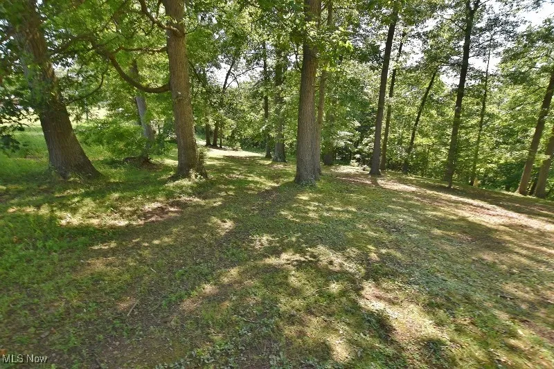 Park-like setting on this beautiful track of nearly 6 acres in SE Carroll County