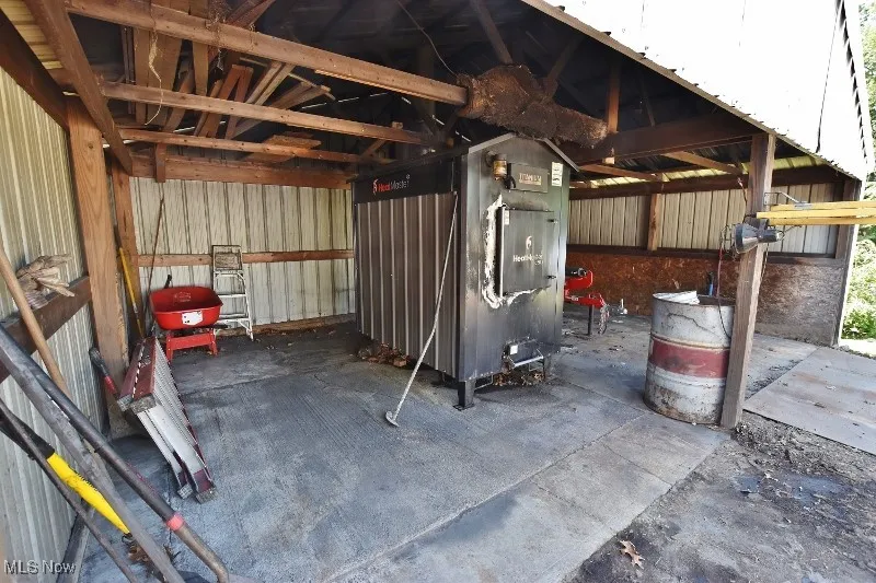 A new wood boiler system is installed and can heat the house, the 5 bay garage as well as the finished garage closest to the house.