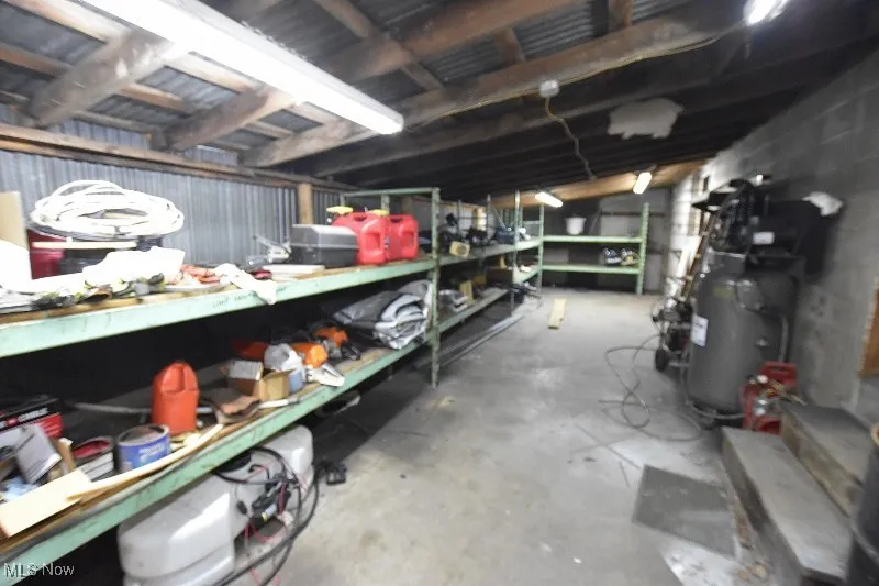 This is a large storage room located on the back side of the 5 bay garage.