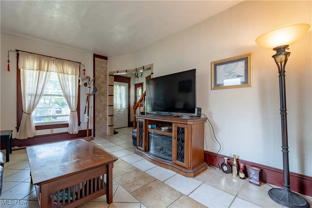 Living area featuring light tile patterned floors